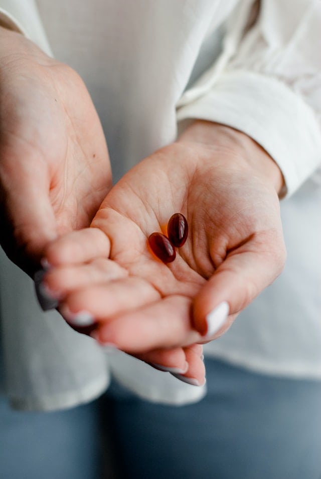 Krill Oil supplement in palm